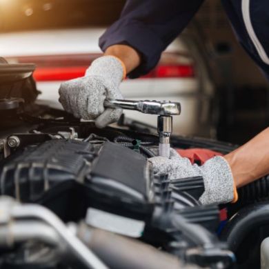 mechanic fixing an engine